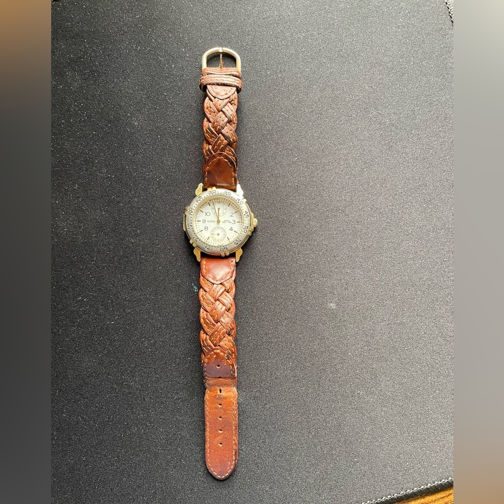 Guess gold and silver dial with a white face and brown band